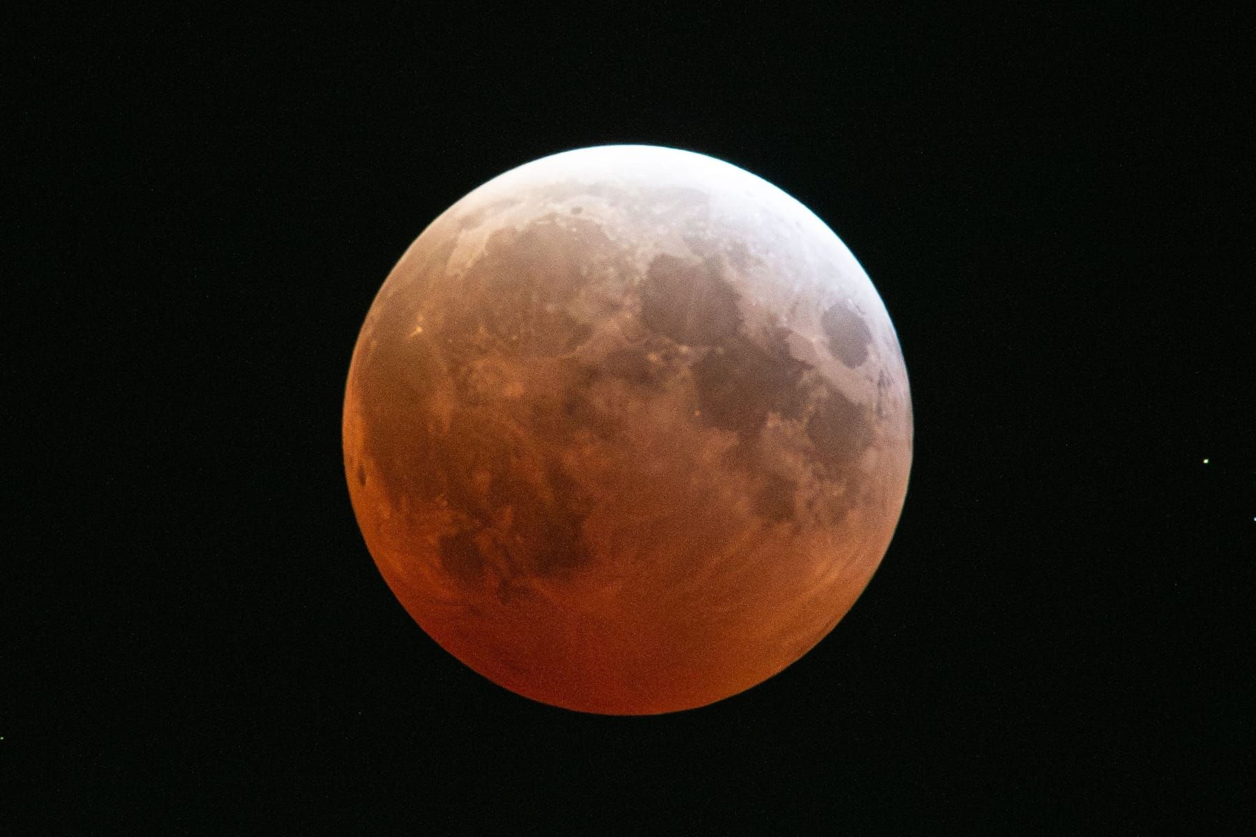 The Moon glowing deep red during a total lunar eclipse