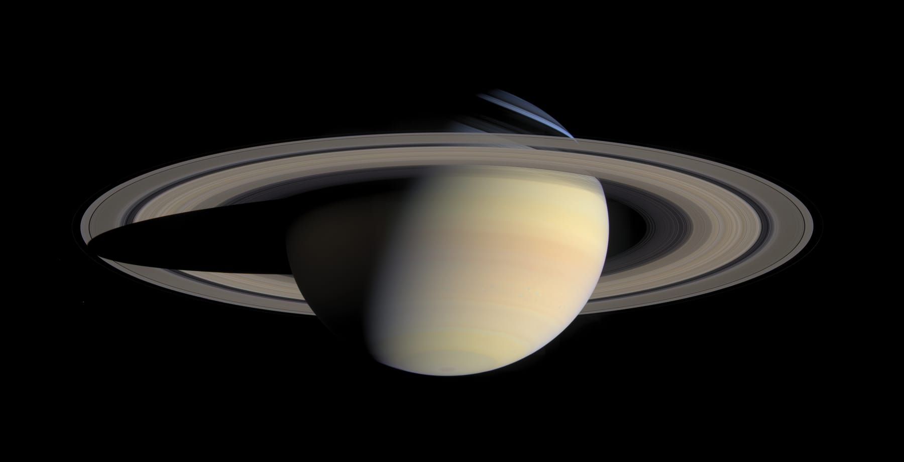 Saturn with its wide rings and the planet’s shadow falling across them, in natural colour