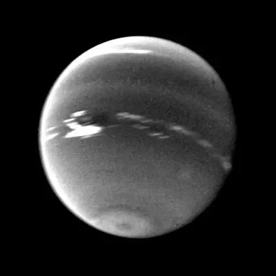 This photo was taken by NASA's Voyager 2's wide-angle camera. Light at methane wavelengths is mostly absorbed in the deeper atmosphere. The bright, white feature is a high-altitude cloud just south of the Great Dark Spot.
